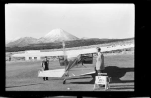 Boarding a small plane, with Mount Ngauruhoe in the background