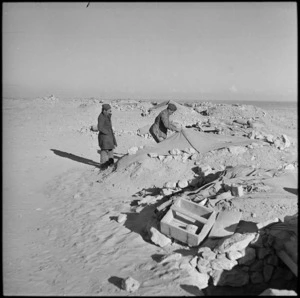 NZ troops inspecting Italian dugouts after first battle of Western Desert