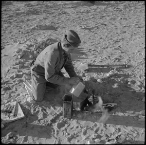 NZ driver cooking own meal during the battle in the Western Desert