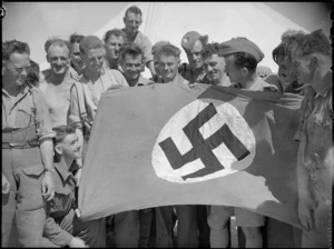 Lt Col J R Page and platoon members with captured Nazi flag