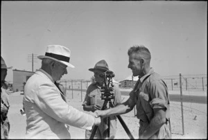 Prime Minister Peter Fraser greeting troops at a camp, Egypt