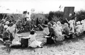 Children attending an outdoor lesson while at a health camp