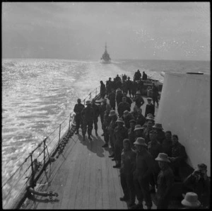 NZ troops on quarterdeck of warship sailing to Greece