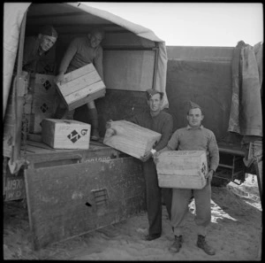 Unloading gift parcels from National Patriotic Fund Board for distribution to NZ troops in Western Desert