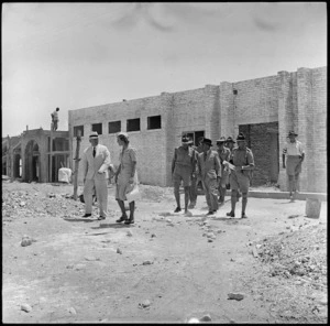 Prime Minister Peter Fraser and Mrs Chapman leaving the Lowry Hut, Egypt
