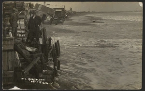 Coastline, with buildings, at Hokitika, West Coast, possibly during an extreme high tide - Photograph taken by Ring and Son