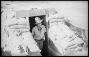 An officer emerging from his dugout in the Western Desert