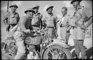 Army motorcyclist with onlookers, Egypt