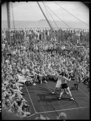 Boxing match in progress on troopship
