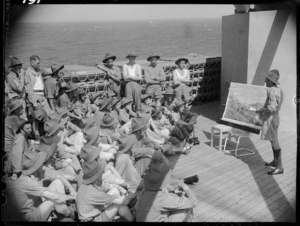 Instruction in map reading aboard troopship