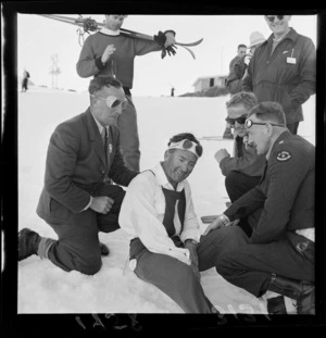 St John staff talking to an injured skier at the New Zealand Ski Championship, Mt Ruapehu