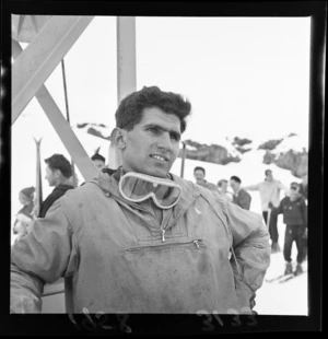 An unidentified skier at the New Zealand Ski Championship, Mt Ruapehu, showing other skiers in the background