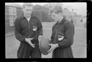 Two unidentified athletes from New Zealand throwing a rugby ball at the British Empire Games, Cardiff, United Kingdom