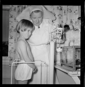 A nurse and child during a health examination for school children
