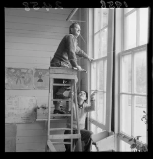 Two unidentified men, one on a ladder and the other holding it at the Johnsonville School working bee, Wellington