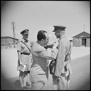 Brigadier Reginald Miles being invested with the Greek Military Cross by Greek Minister of War