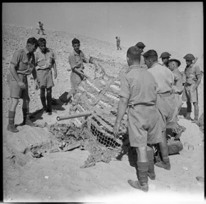 A 2 pounder anti tank gun in position and under camouflage at El Saff, Egypt, during World War II