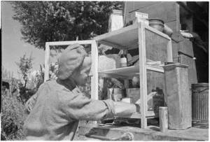 New Zealand soldier checking food stores of a New Zealand Engineers truck near Pesa River, Tuscany, Italy - Photograph taken by George Kaye