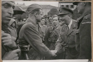 Lt-Gen Bernard Cyril Freyberg shakes hands with an officer of the 9th Yugoslav Corps at Monfalcone, Italy