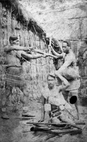 Re-enactment of hand-to-hand fighting in a Maori village