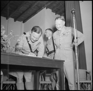 GOC signing the visitor's book at the opening of the Lowry Hut, Egypt