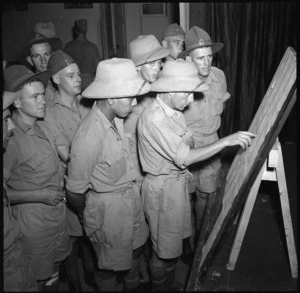 Troops reading casualty list at the NZ Forces Club, Cairo