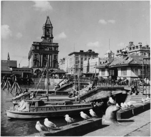 Scene on the Auckland waterfront showing the Ferry Building and waiting rooms
