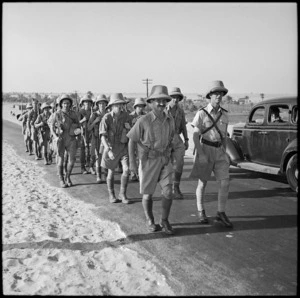 Former All Black Lt Col J R Page with his platoon on route march, Helwan