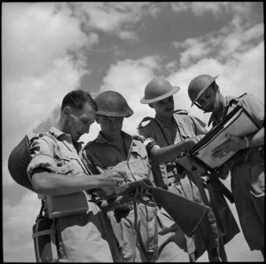 Officers checking results of combined troop exercise, Egypt