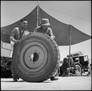 Showing large size of tyre off captured enemy truck, Egypt