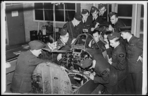 NZ pilots inspect a Spitfire, Canada