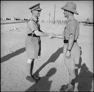 King George of Greece is greeted by a senior officer on arrival at Helwan