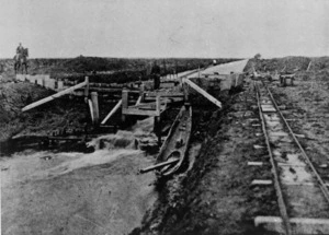 View of Awaiti Canal showing a portion of railway track and a Maori canoe