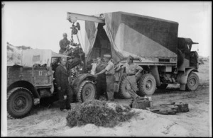 Light Aid Detachment Engineers changing truck engine, Egypt