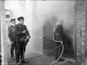 Firemen using smoke helmet equipment, Christchurch Central Fire Station