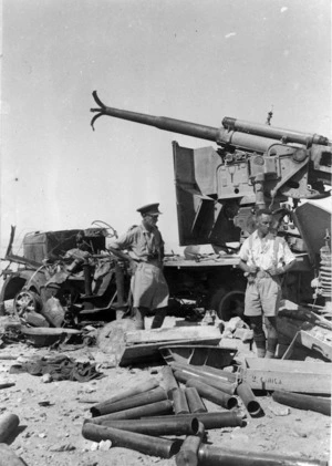 Brigadier Howard Karl Kippenberger and Captain Allan McPhail examining a captured Italian 90mm AA gun