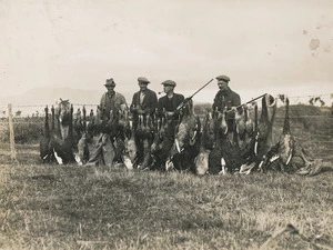 Creator unknown : Photograph of duck shooters and bag, Lake Wairarapa district