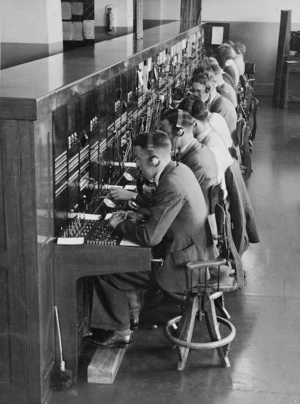 Men and women at the Wellington Toll Exchange handling long distance calls