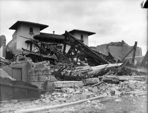 Remains of a Methodist Church after the 1931 Hawke's Bay earthquake, with the Municipal Theatre in the background