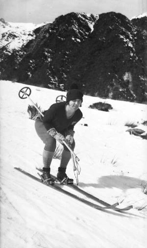 Person snow skiing down a slope