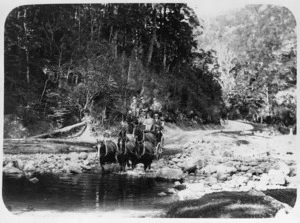 Coach with passengers crossing a river