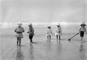 A group of children playing at the seaside