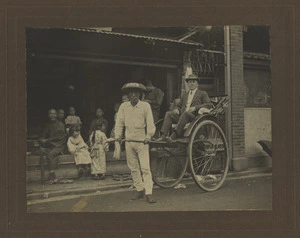 Henry Jull seated in a rickshaw, Japan