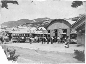 Steam trams, and men, outside the Wellington City Tramways depot, Newtown, Wellington
