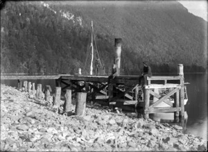 Dore, John Benjamin Charles :Building the wharf at Glade House, Lake Te Anau, with the steamer Tawera alongside