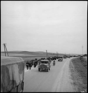 Prisoners marching back to POW cages, Tunisia - Photograph taken by M D Elias