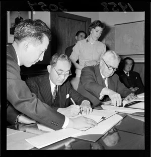 Prime Minister Mr Walter Nash and Japanese Ambassador Mr Shimadzu, signing a trade agreement