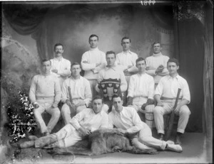Studio photograph of unidentified men's cricket team, with shield, probably Christchurch district