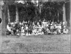 A group of unidentified people with brass instruments, in an unidentified park, probably Christchurch district