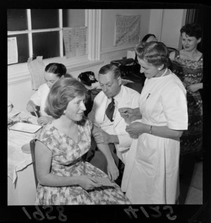 Unidentified woman having a polio vaccination at Hotel Cecil, Thorndon, Wellington